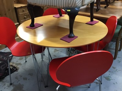 Lot 944 - Contemporary beech and chrome circular kitchen table and four vermillion red and chrome chairs