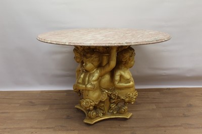 Lot 1253 - 19th century carved giltwood cherub pedestal with circular pink veined marble circular top