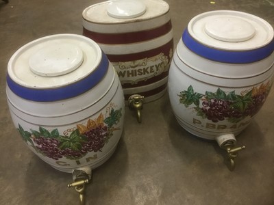 Lot 161 - Three large ceramic spirit barrels, each with painted ornament, approximately 34cm high