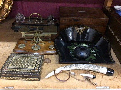 Lot 506 - Set of postal scales, desk pen holder with glass ink wells, wooden box, parallel rolling rule, fish net tool and sundries