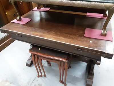 Lot 998 - Oak refectory style draw leaf dining table on pierced shaped end standards joined by stretcher, 122cm wide, 81cm deep, 78.5cm high