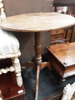 Lot 1011 - Georgian wine table with circular tilt top on turned column and three hipped splayed legs, 61cm diameter, 70.5cm high