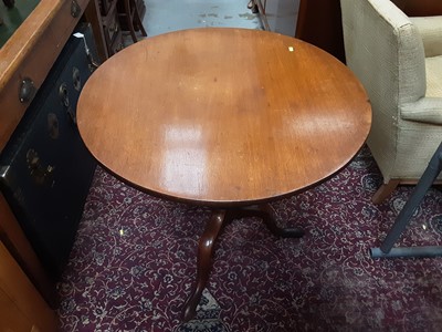 Lot 1023 - Georgian mahogany wine table with circular tilt top on turned column and three hipped splayed legs, 75.5cm diameter,  71cm high