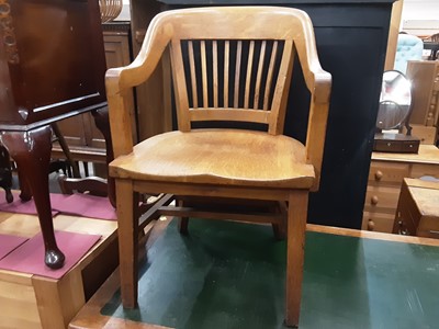 Lot 1030 - Early 20th century oak elbow desk chair