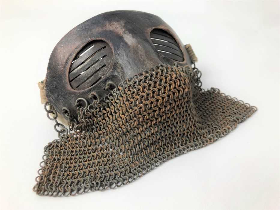 Lot 732 - Scarce First World War tank crew face mask of steel construction with leather covering, attached chain mail and cotton retaining tabs.