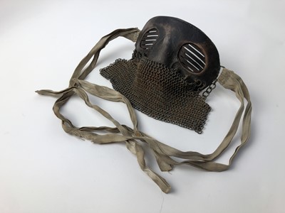 Lot 732 - Scarce First World War tank crew face mask of steel construction with leather covering, attached chain mail and cotton retaining tabs.