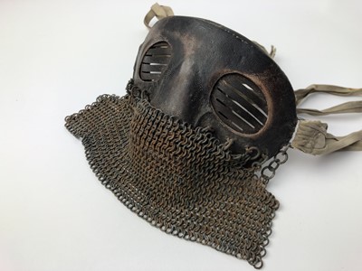 Lot 732 - Scarce First World War tank crew face mask of steel construction with leather covering, attached chain mail and cotton retaining tabs.