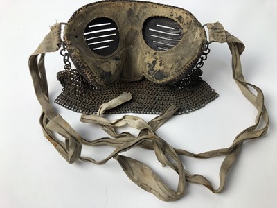 Lot 732 - Scarce First World War tank crew face mask of steel construction with leather covering, attached chain mail and cotton retaining tabs.