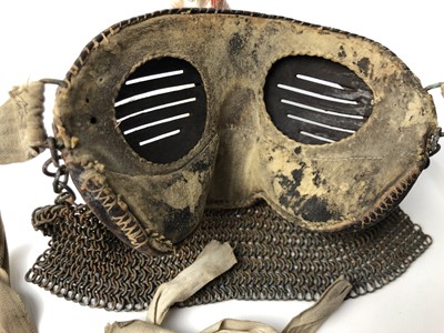 Lot 732 - Scarce First World War tank crew face mask of steel construction with leather covering, attached chain mail and cotton retaining tabs.