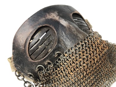 Lot 732 - Scarce First World War tank crew face mask of steel construction with leather covering, attached chain mail and cotton retaining tabs.