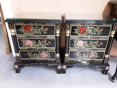 Lot 1039 - Pair of oriental black lacquered three drawer bedside chests, with chinoiserie, bird and floral decoration, 51cm wide, 38cm deep, 62.5cm high