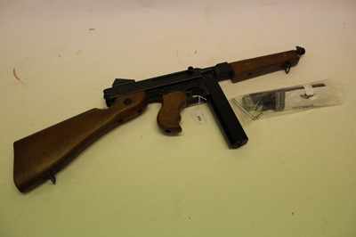 Lot 955 - A Umarex 'King Arms' M1A1 military Thompson SMG A.E.G. BB gun with twin magazines and instruction manual