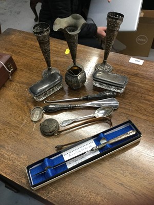 Lot 695 - Group of Eastern white metal vases, two silver topped vanity jars, sugar tongs and other silver and plated ware