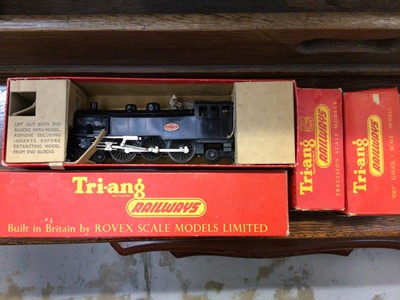 Lot 561 - Tinplate clockwork train with tender and two carriages plus track together with Triangle locomotive, carriage and two wagons, boxed, and two raincoats