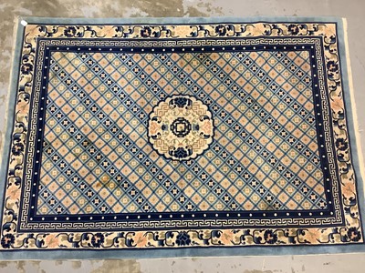 Lot 967 - Chinese rug with geometric decoration on blue and beige ground, 245cm x 172cm