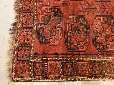 Lot 969 - Eastern rug with geometric decoration on red and blue ground, 270cm x 216cm