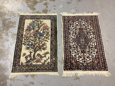 Lot 974 - Small Eastern rug with tree, deer and bird decoration, 100cm x 64cm together with another small rug, 97cm x 62cm