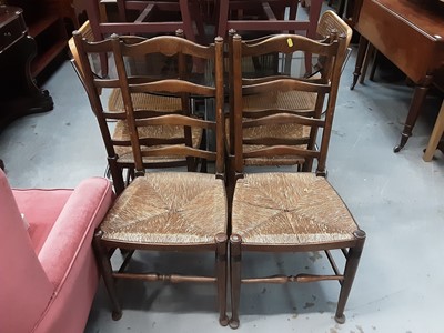 Lot 1074 - Set of four oak ladderback chairs with rush seats