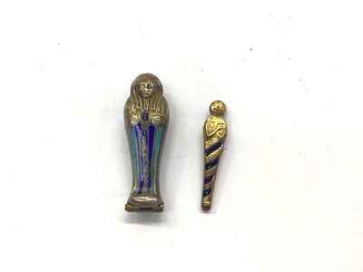 Lot 716 - Egyptian revival silver and enamel sarcophagus pendant with mummy inside