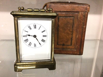 Lot 399 - Brass carriage clock in leather travelling case