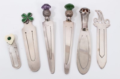 Lot 30 - Six silver bookmarks to include three mounted with stones, enamelled shamrock, gem set heart and letter M