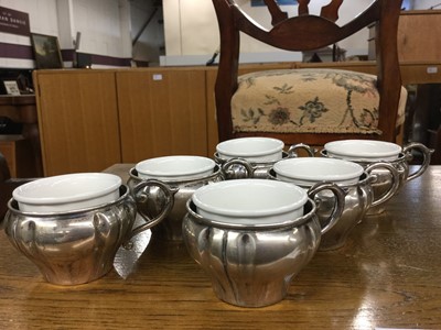 Lot 728 - Six French silver cups with ceramic liners