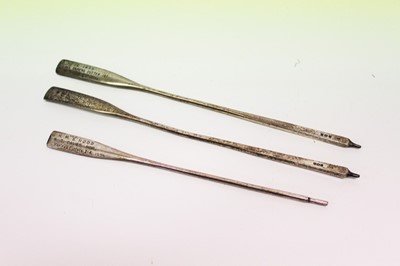 Lot 862 - Group of three 1930's silver Presentation trophy oars from HMS Royal Oak, all engraved and named to N.T. Davies, each approximately 20cm in length.