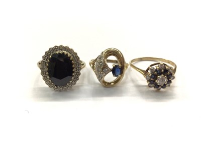 Lot 744 - Large oval sapphire and diamond cocktail ring and two other 9ct gold gem set rings