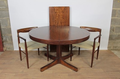 Lot 1422 - Scandinavian  rosewood dining table together with a set of six rosewood armchairs