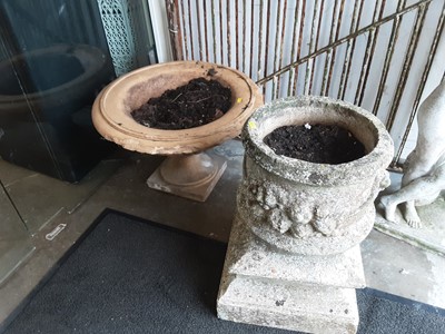 Lot 1083 - Concrete garden urn, 52cm high and one other planter, 36cm high, 57cm diameter (2)