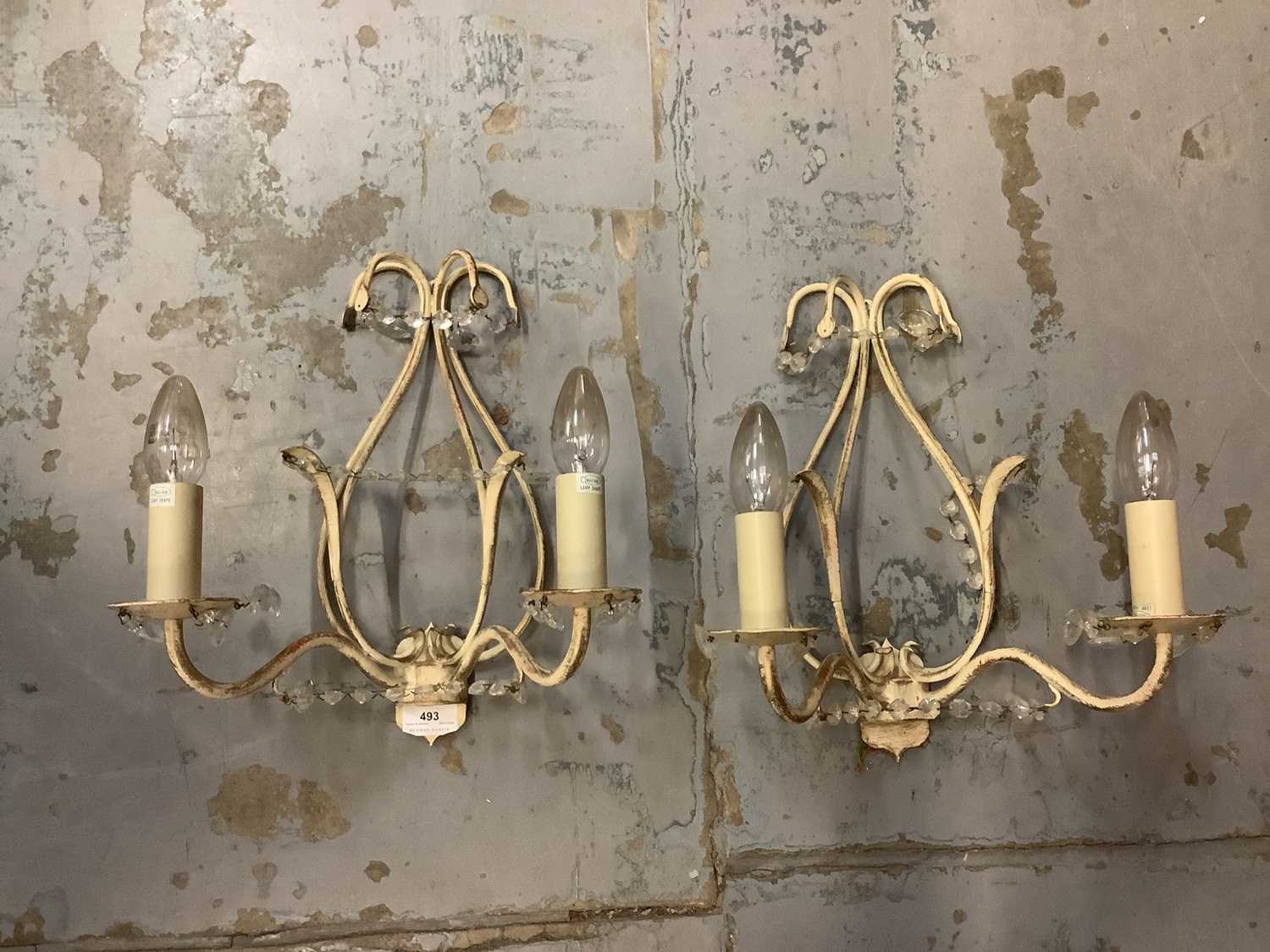 Lot 493 - Jim Lawrence Wortham wall lights in cream