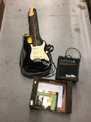 Lot 592 - Hohner Rockwood LX90 electric guitar, together with a Gorilla amp and collection of sheet music