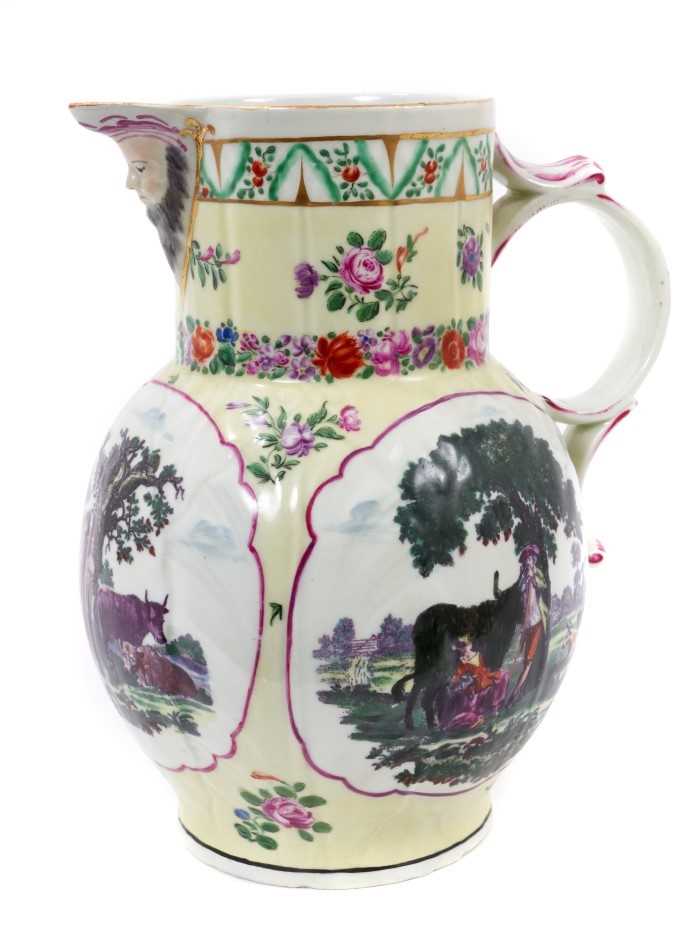 Lot 20 - A large Worcester yellow ground cabbage leaf jug, printed in black by Robert Hancock with 'Shepherd and Shepherdess', 'Rural Lovers' and 'Milking Scene (1)', circa 1770