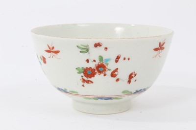 Lot 123 - A Worcester black printed saucer, a similar tea bowl, a Worcester small green ground mug and a polychrome tea bowl