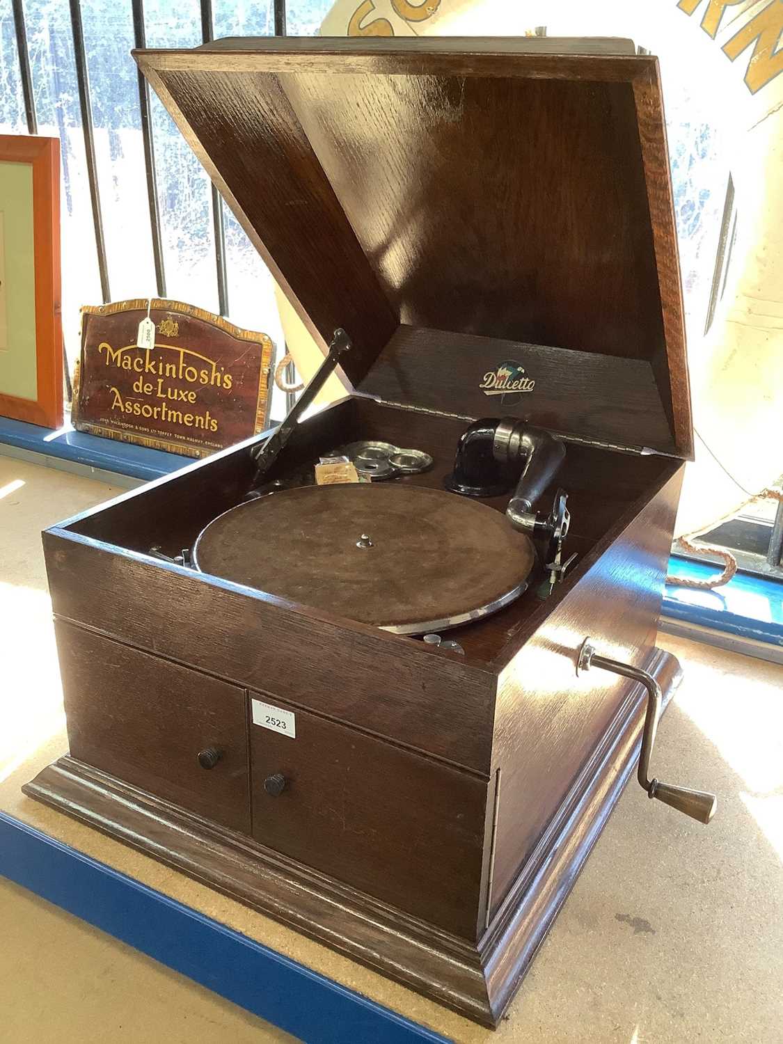 Lot 2523 - Dulcetto gramophone in oak cabinet and a box of records