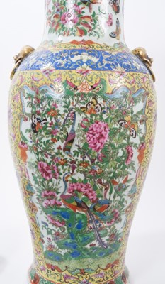 Lot 151 - Large 19th century Chinese famille rose porcelain vase and cover, of baluster form, decorated with panels of flowers, birds and insects on a yellow patterned ground, with moulded mask and ring hand...