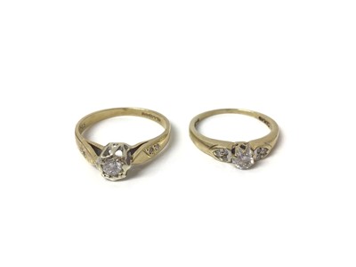 Lot 701 - Two 9ct gold diamond solitaire rings with diamond set shoulders