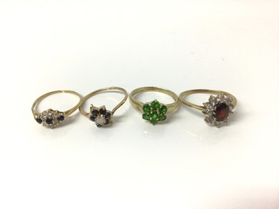 Lot 703 - Four 9ct gold gem set dress rings