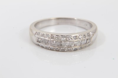 Lot 63 - Two 9ct white gold diamond set half eternity style rings