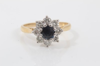 Lot 64 - 18ct gold diamond and sapphire flower head cluster ring