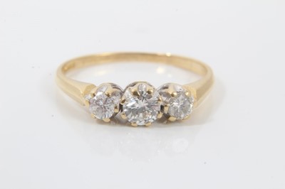Lot 65 - 18ct gold diamond three stone ring
