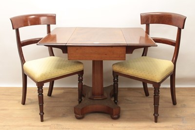 Lot 1264 - Late Regency mahogany Pembroke table with pedestal column and quatrefoil plateau base on bun feet, together with a pair of late Regency mahogany bar back side chairs