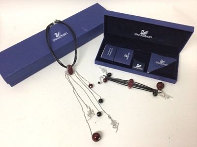 Lot 650 - Swarovski necklace and matching bracelet, both boxed as new