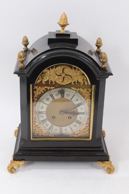 Lot 960 - Late 19th century bracket clock with 8 day striking movement, arched brass dial 
with cast spandrels in ebonized case with brass mounts, approximately 35cm 
high