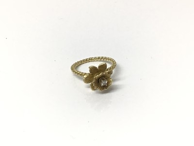 Lot 655 - 14ct gold daffodil ring set with single stone diamond to the centre on rope twist shank