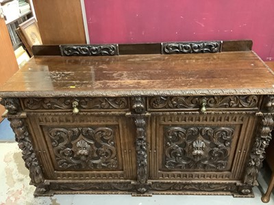 Lot 854 - Late Victorian heavily carved oak sideboard