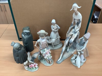 Lot 1159 - Four Lladro figures, boxed, two others and a Nao figure