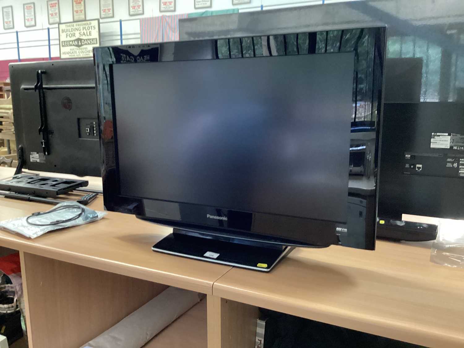 Lot 128 - Panasonic TV with remote and manual