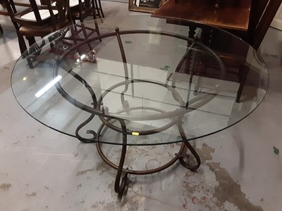 Lot 858 - Large good quality circular dining table with glass top on wrought metal base