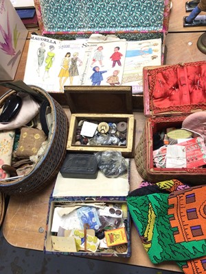 Lot 438 - Sewing boxes containing vintage dress patterns, buttons, sewing accessories and a beaded bag